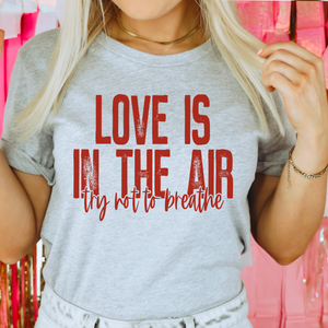 Love Is In The Air Try Not To Breathe Graphic Tee